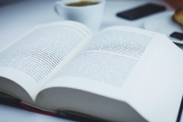Open book and warm drink